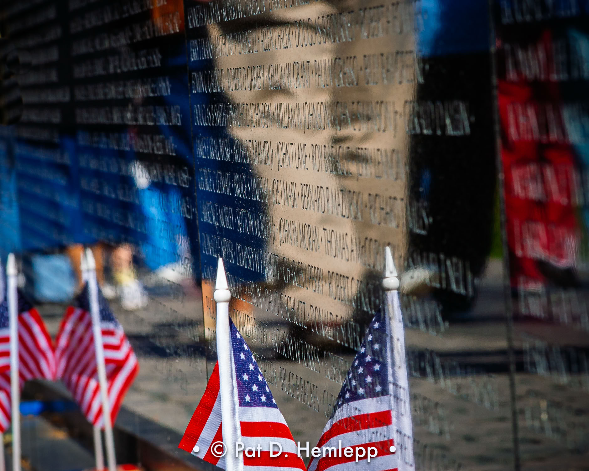 Passing visitors are reflected in the wall of the Vietnam Veterans Memorial in Washington, D.C. 