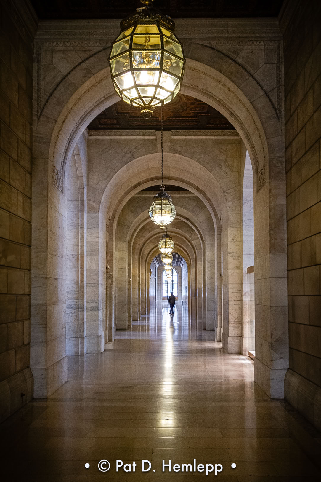 Viewing an arched hallway inside the New York Public Library, New York City.