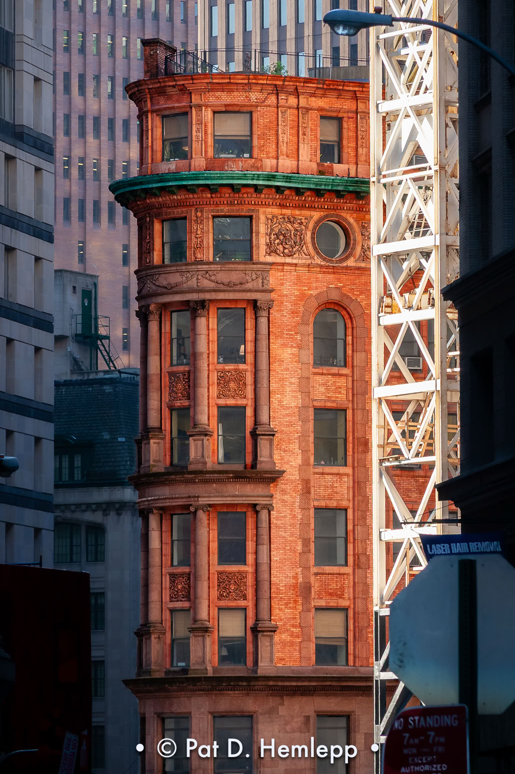 Sunlight bathes the Delmonico's building on the corner of William and Beaver streets in New York City. 