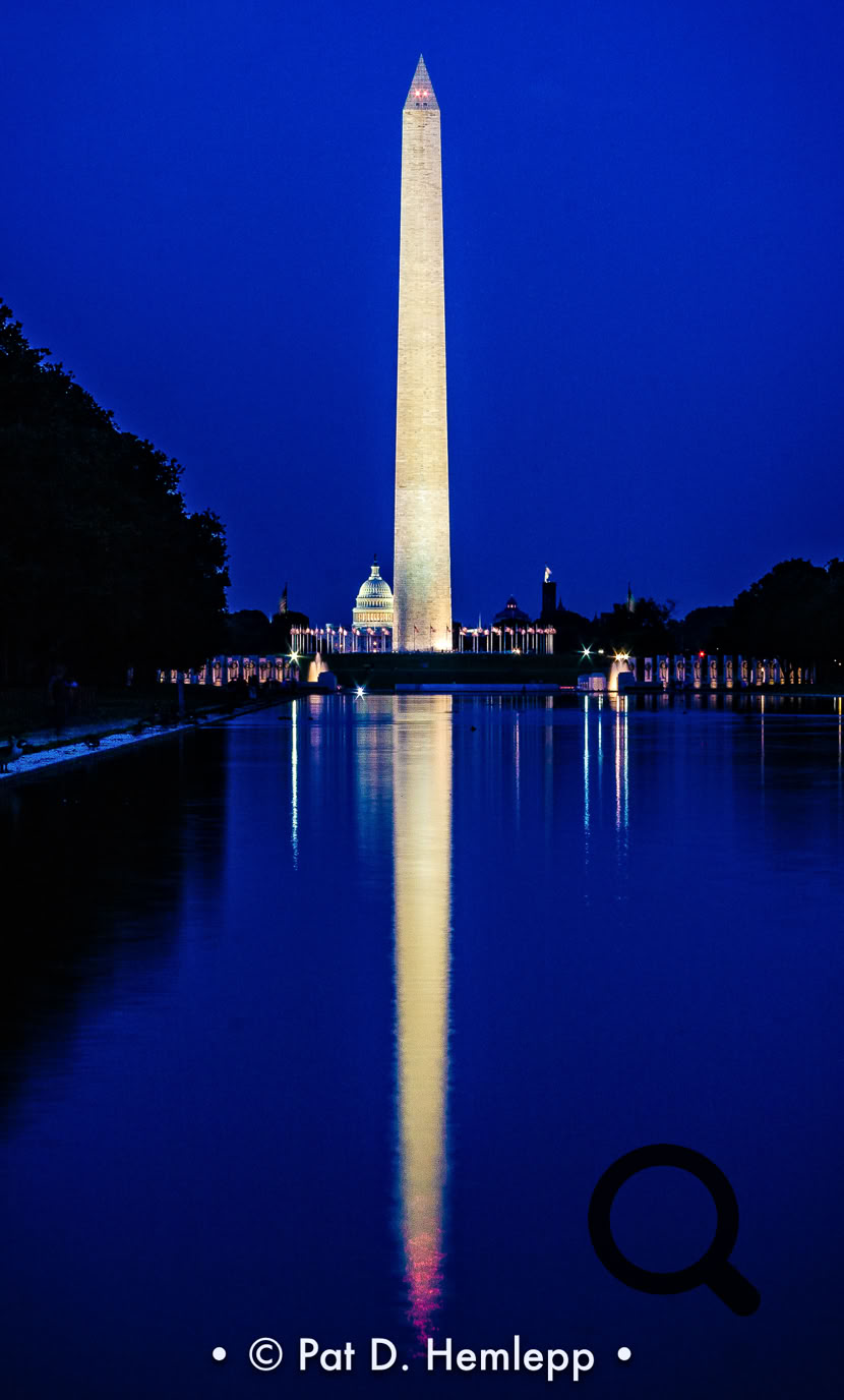 The Washington Monument mirrored in the Reflecting Pool after sunset, Washington, D.C.