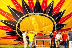 A crew inflates the canopy of a hot-air balloon during a festival in Grove City, Ohio.